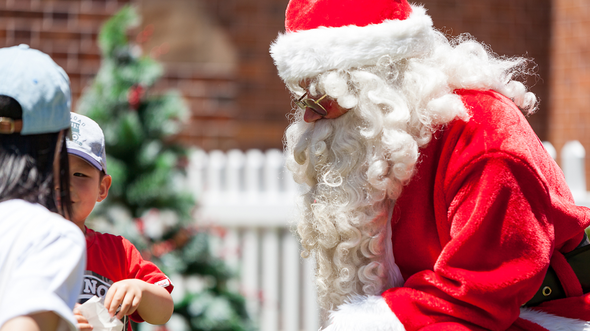 Santa giving gifts to children at Discovery Point